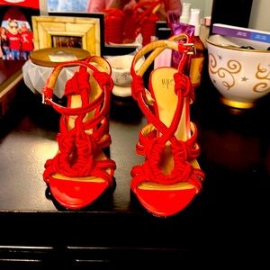 Red chunky heel sandal.